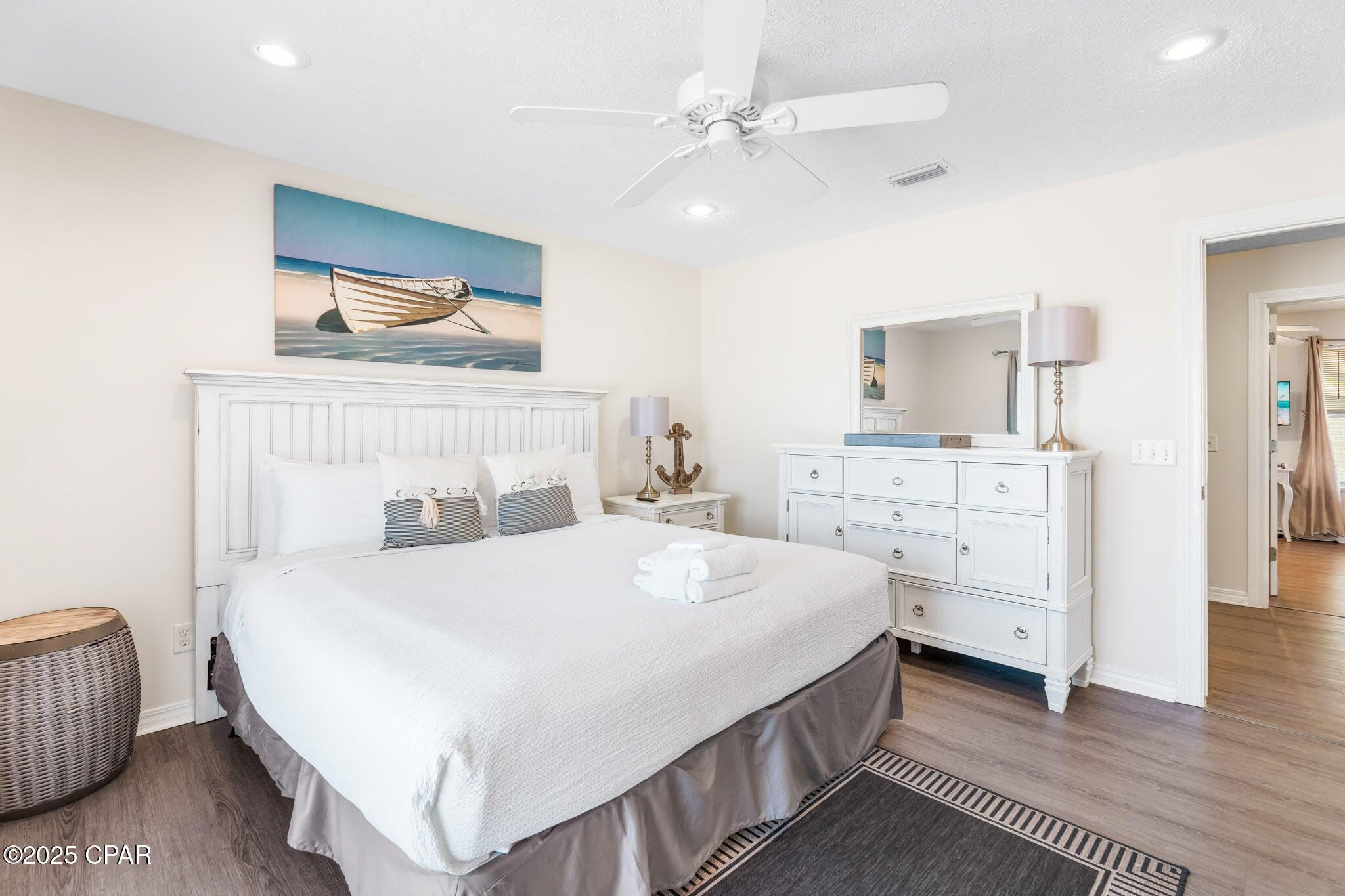 17657 Front Beach Road, Unit B Panama City Beach, FL 32413 - Photo 15 of 34 a bedroom with a bed and a couch