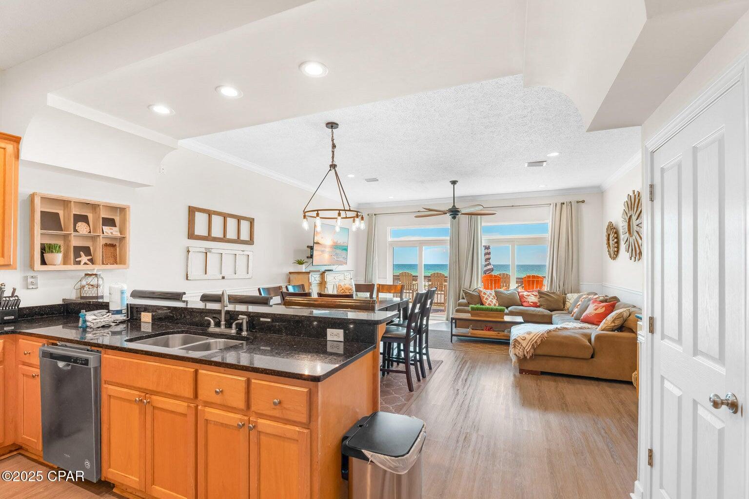 17657 Front Beach Road, Unit B Panama City Beach, FL 32413 - Photo 18 of 34 a very nice looking living room with a large window and wooden floor