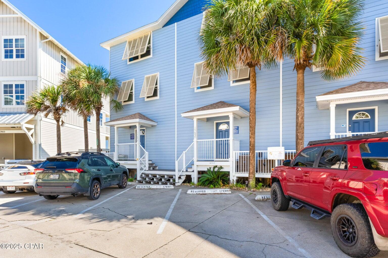 17657 Front Beach Road, Unit B Panama City Beach, FL 32413 - Photo 2 of 34 a front view of a house with parking space