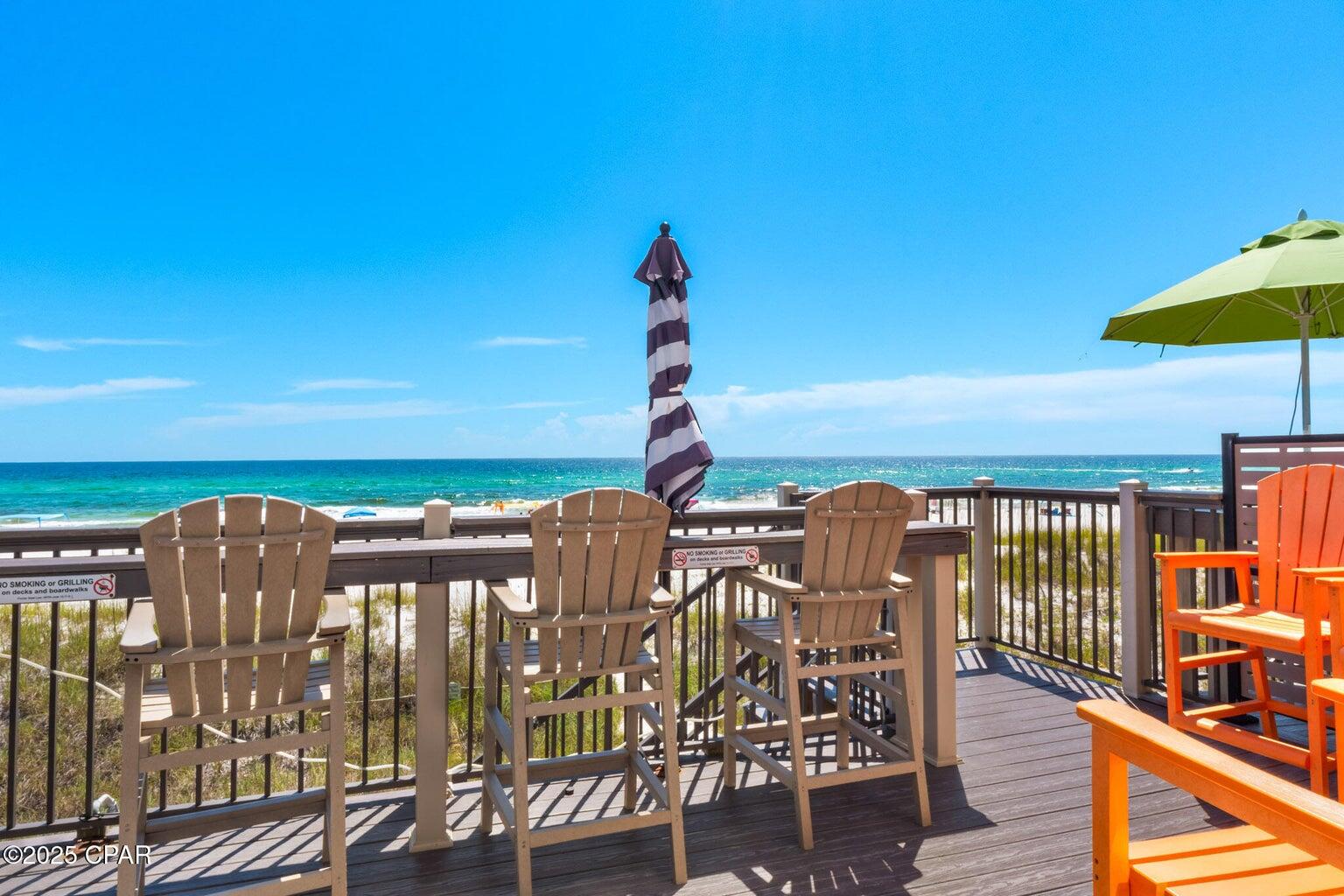 17657 Front Beach Road, Unit B Panama City Beach, FL 32413 - Photo 4 of 34 a view of a balcony with chairs