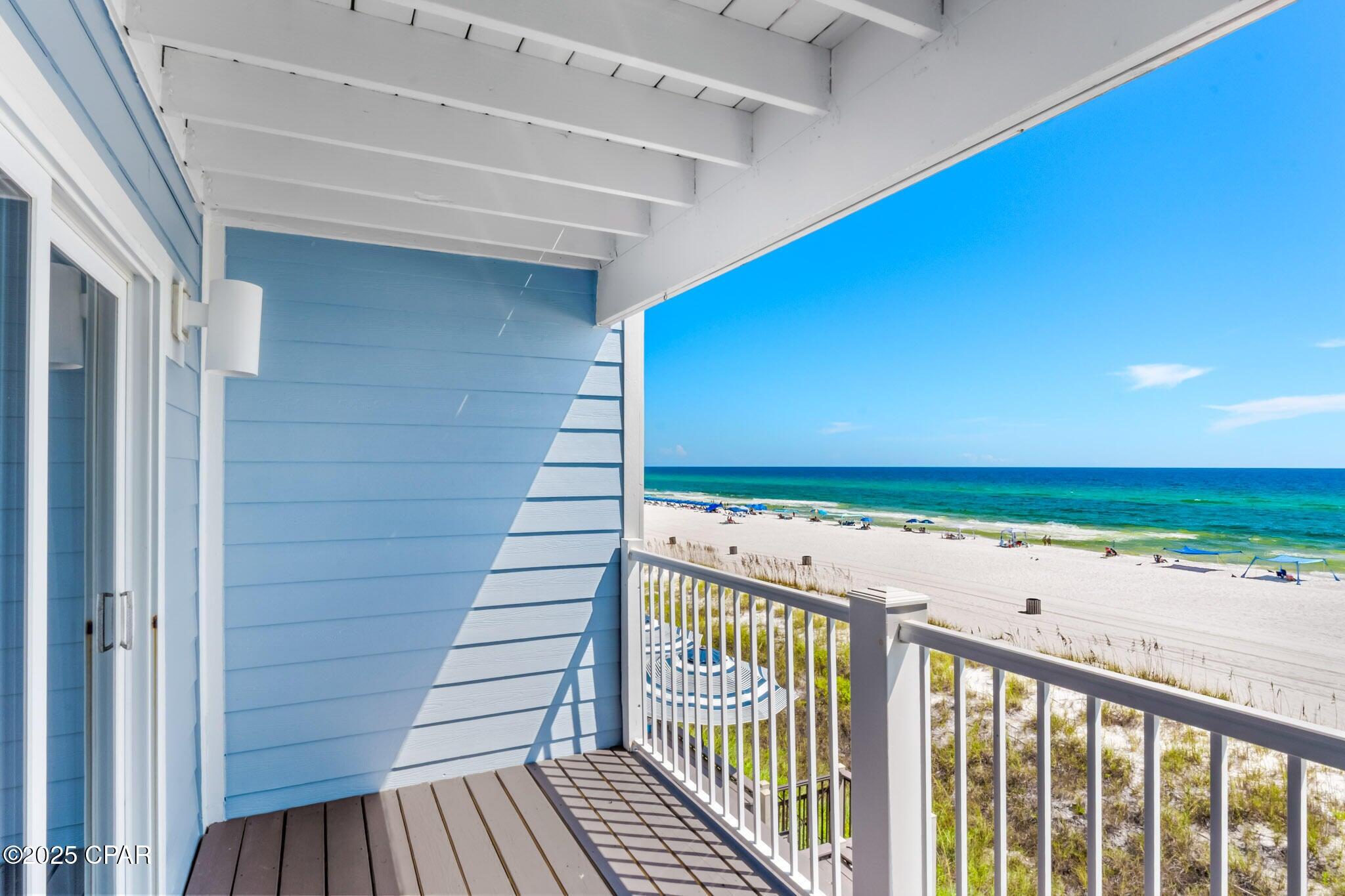 17657 Front Beach Road, Unit B Panama City Beach, FL 32413 - Photo 6 of 34 a view of a balcony with wooden floor
