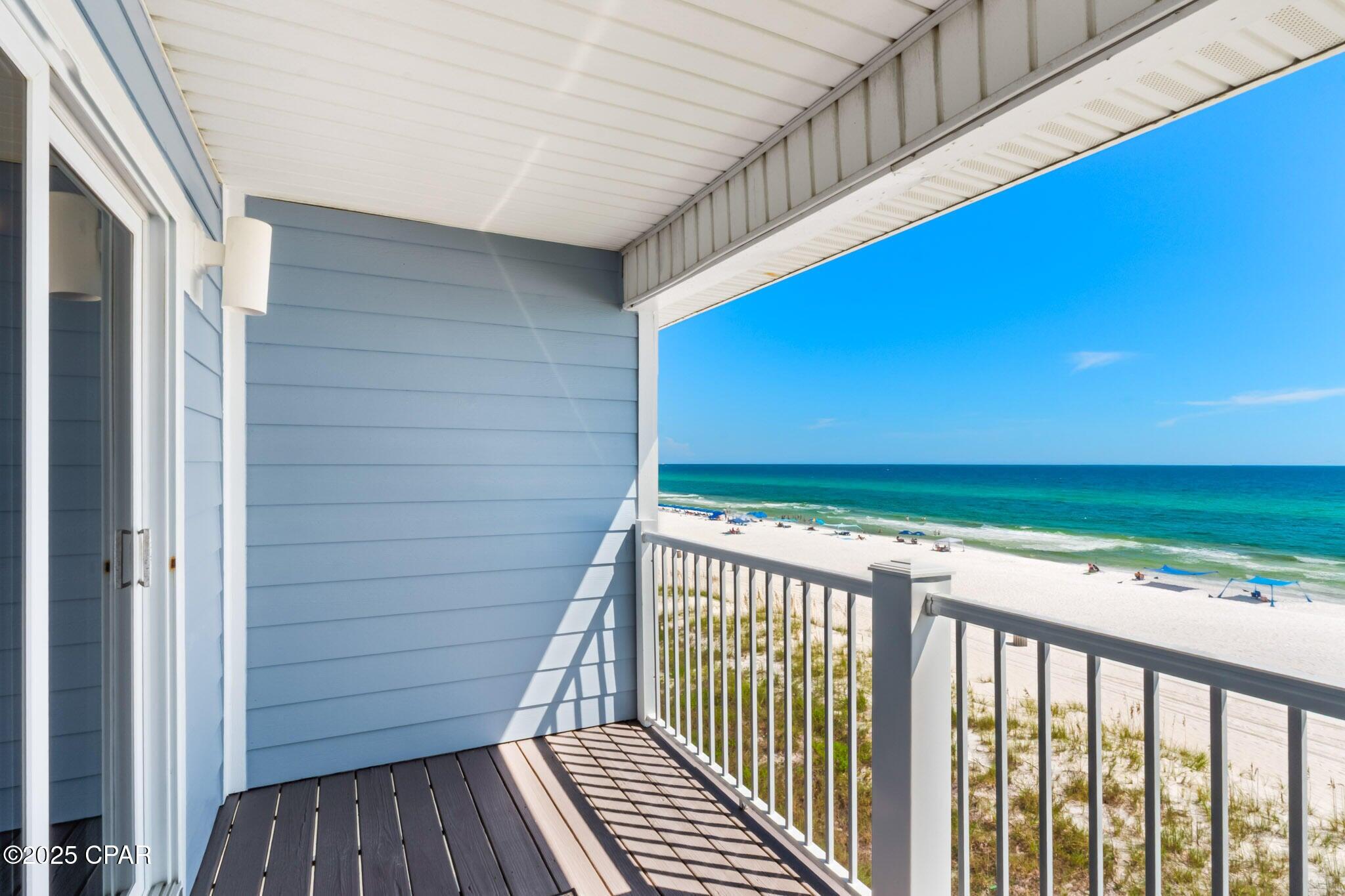 17657 Front Beach Road, Unit B Panama City Beach, FL 32413 - Photo 7 of 34 a view of a balcony with wooden floor
