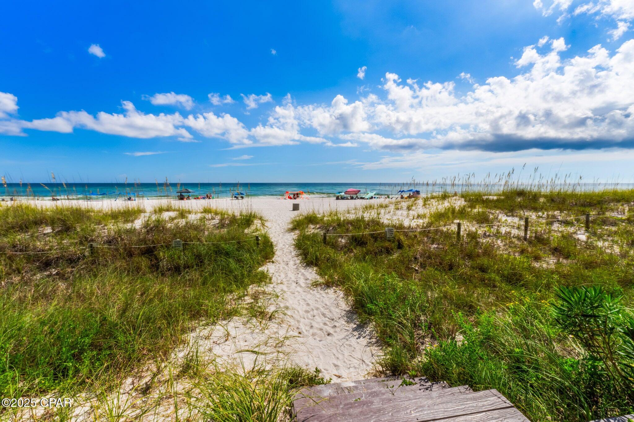 17657 Front Beach Road, Unit B Panama City Beach, FL 32413 - Photo 8 of 34 a view of an ocean from a yard