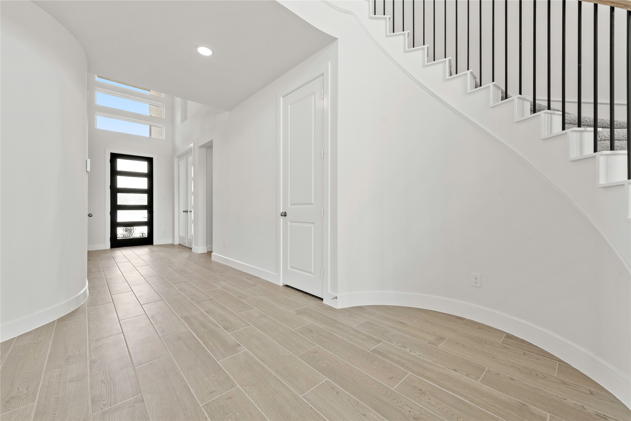 5615 Sandcastle Rdg Drive Katy, TX 77493 - Photo 14 of 27 wooden floor in an empty room with a window