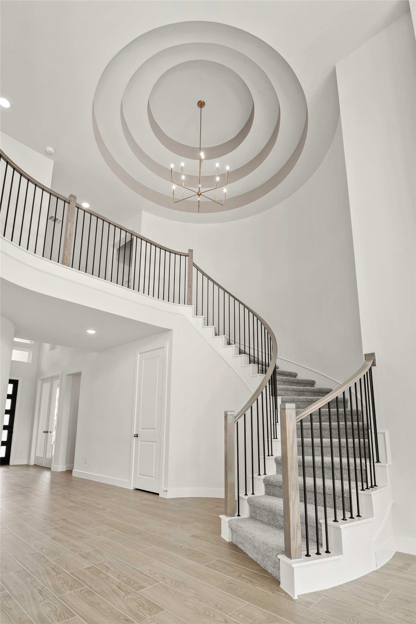 5615 Sandcastle Rdg Drive Katy, TX 77493 - Photo 2 of 27 a view of staircase with white walls and a window