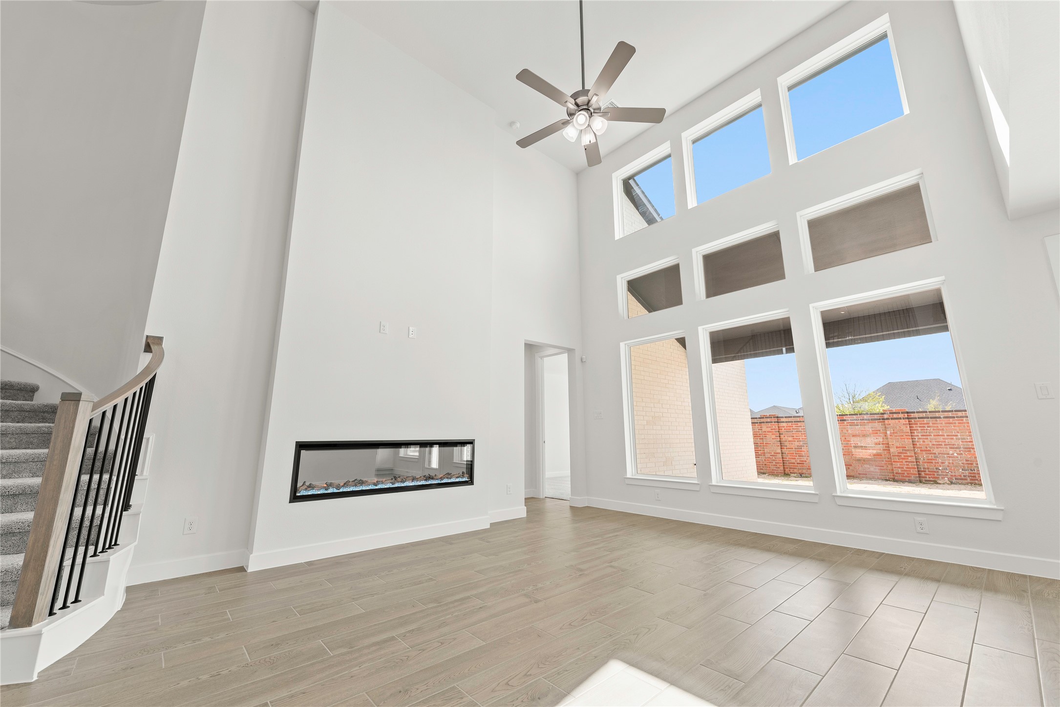 5615 Sandcastle Rdg Drive Katy, TX 77493 - Photo 3 of 27 an empty room with windows and fan