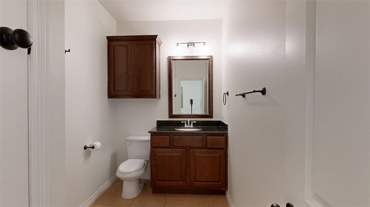 206 North Main Street, Unit 123 Bryan, TX 77803 - Photo 13 of 19 a view of a bathroom with a sink and a toilet