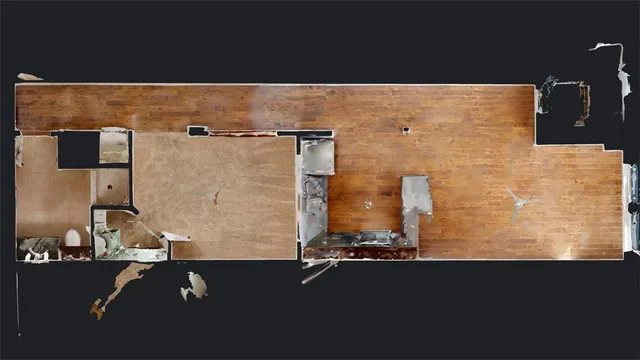 a picture of a bench in front of a wall