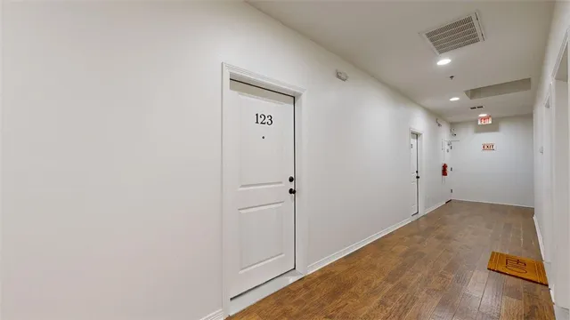 a view of hallway with a wooden floor
