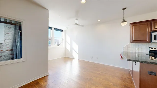 a view of a kitchen with a sink and a window