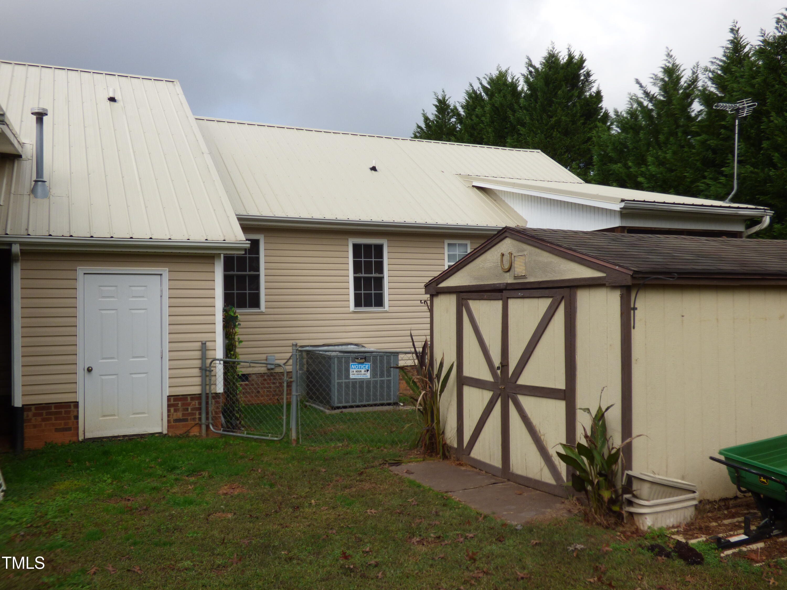 5539 Fieldview Road Mebane, NC 27302 - Photo 35 of 49 outside rear shed storage room door