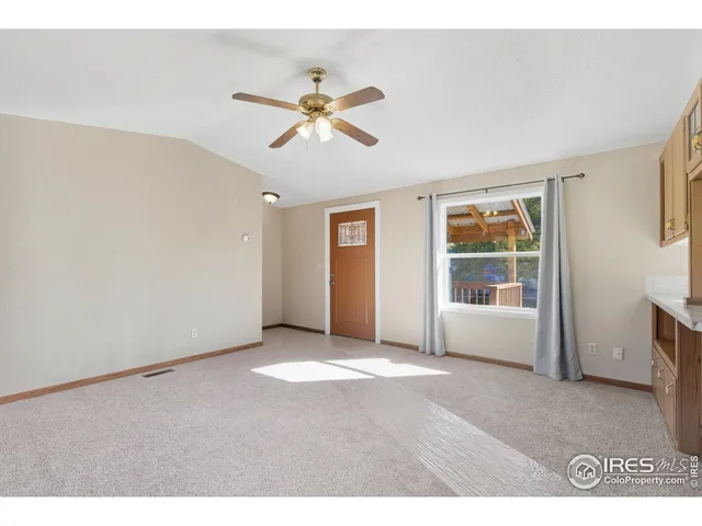 a view of an empty room with a window