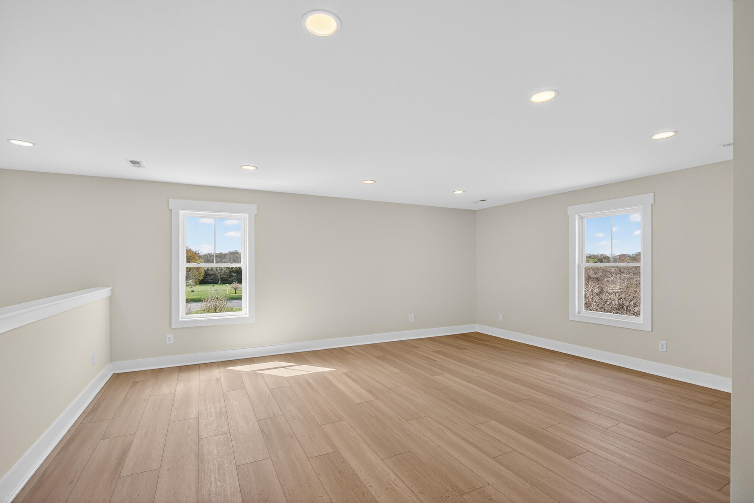 Lot 22 Rolling Road Moneta, VA 24121 - Photo 28 of 45 an empty room with wooden floor and windows