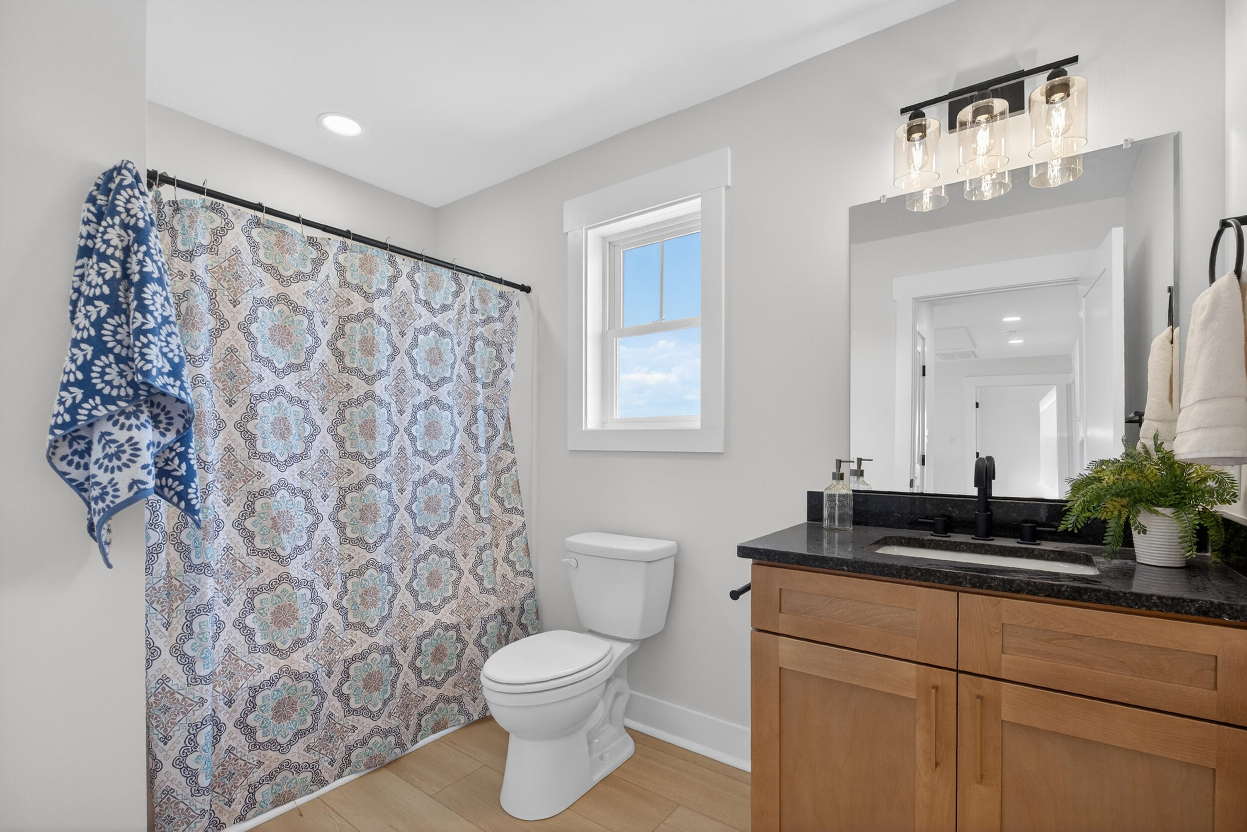 Lot 22 Rolling Road Moneta, VA 24121 - Photo 35 of 45 a bathroom with a granite countertop sink a toilet and a mirror