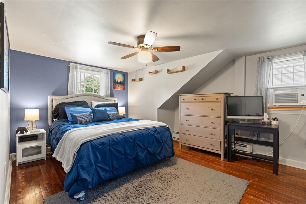 8 Harding Street Cherry Valley, MA 01611 - Photo 12 of 20 a bed room with a bed and a chair