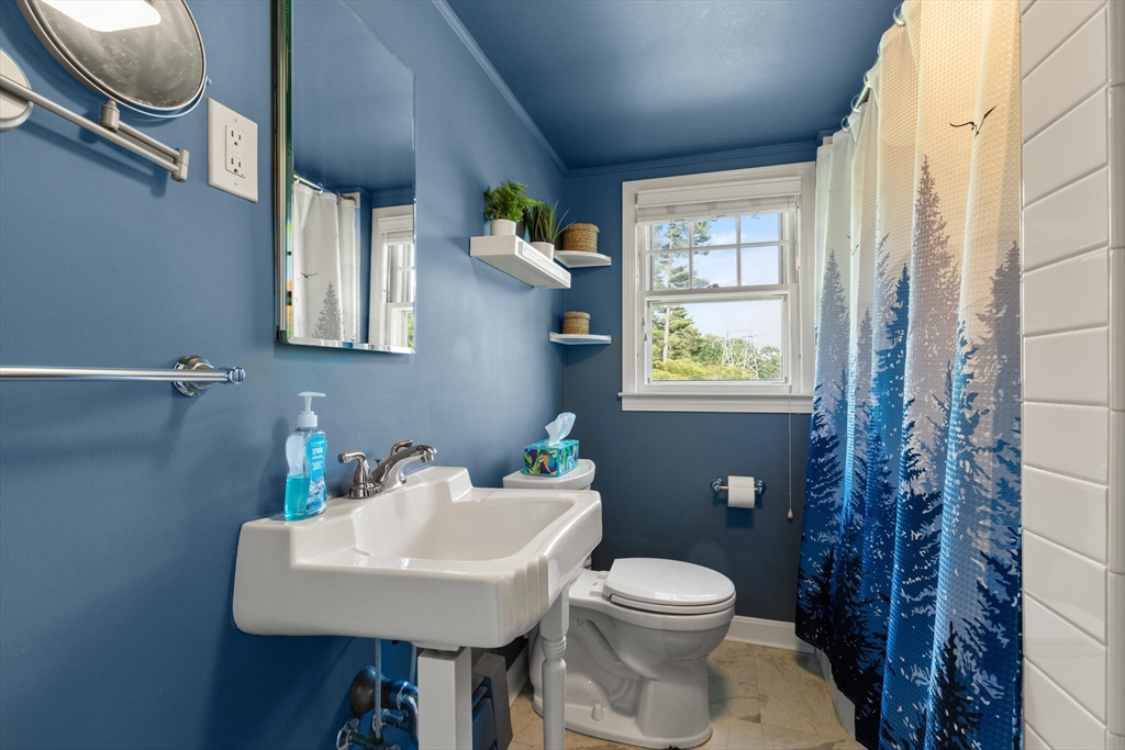 8 Harding Street Cherry Valley, MA 01611 - Photo 14 of 20 a bathroom with a toilet sink and mirror