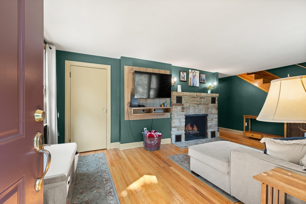 8 Harding Street Cherry Valley, MA 01611 - Photo 2 of 20 a living room with fireplace furniture and a flat screen tv