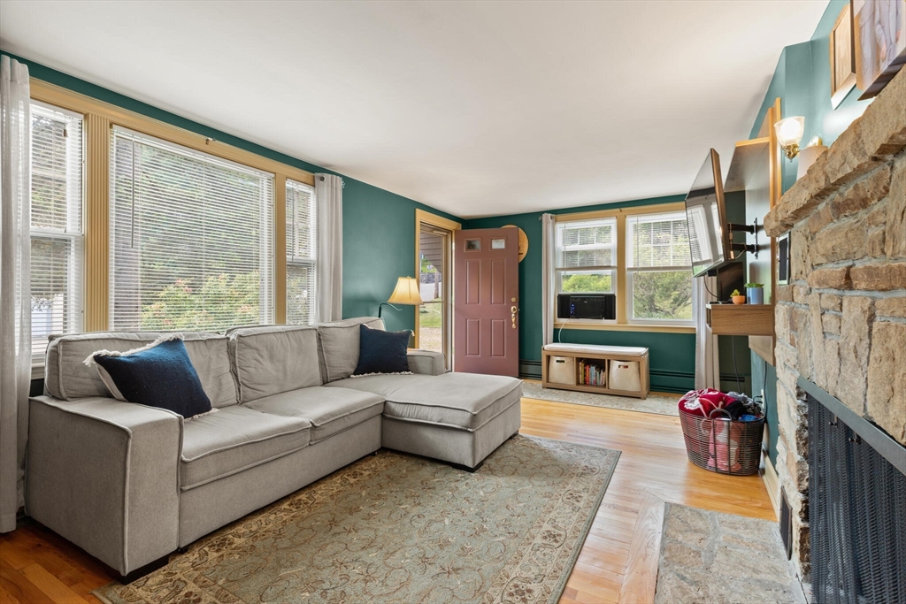 8 Harding Street Cherry Valley, MA 01611 - Photo 3 of 20 a living room with furniture and a fireplace