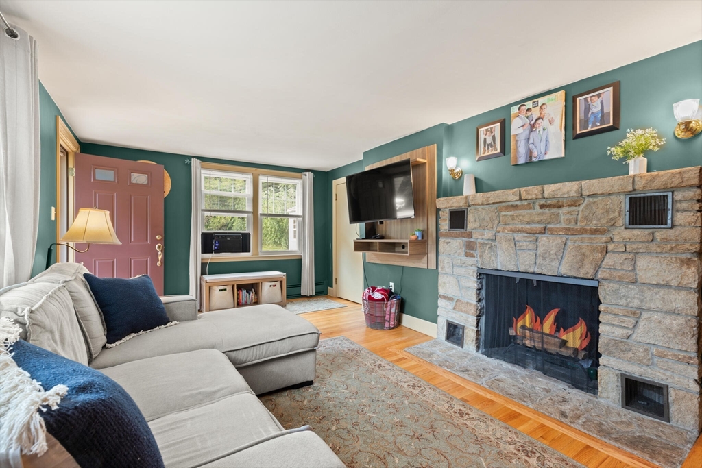 8 Harding Street Cherry Valley, MA 01611 - Photo 4 of 20 a living room with furniture and a fireplace