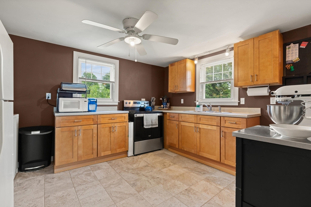 8 Harding Street Cherry Valley, MA 01611 - Photo 6 of 20 a kitchen with a sink window and cabinets