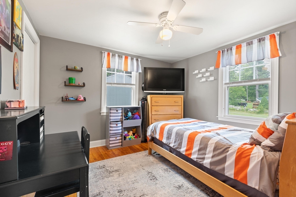 8 Harding Street Cherry Valley, MA 01611 - Photo 9 of 20 a bedroom with a bed and a flat screen tv
