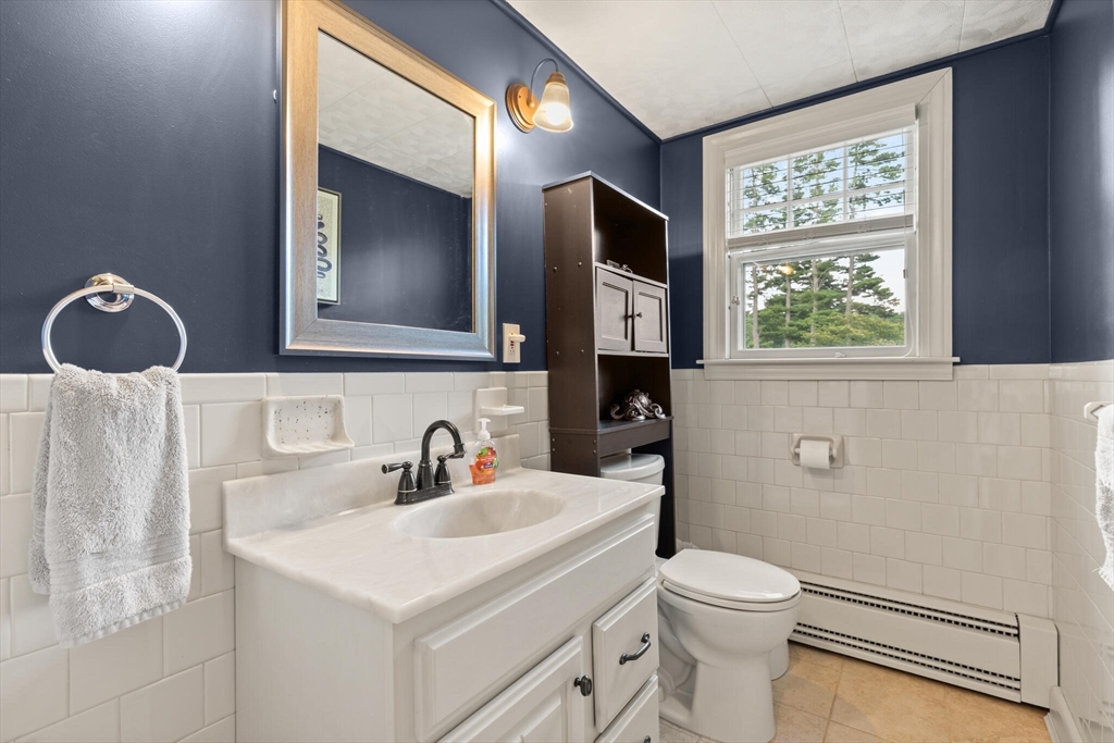 8 Harding Street Cherry Valley, MA 01611 - Photo 10 of 20 a bathroom with a toilet sink and mirror