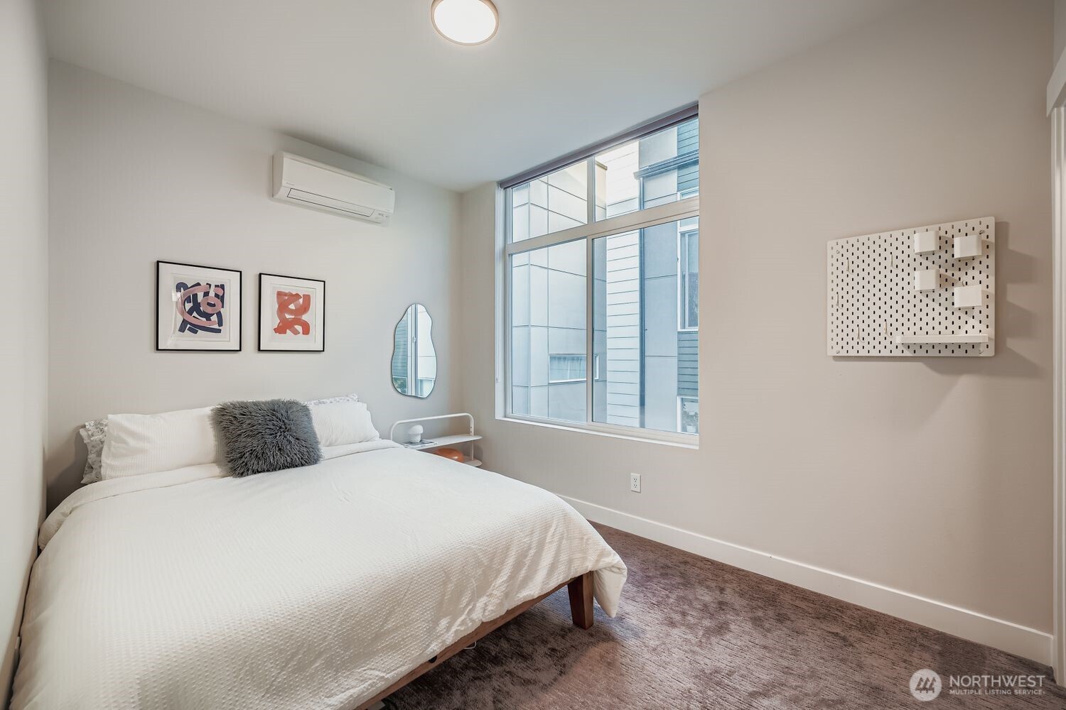 1605 South Washington Street, Unit F Seattle, WA 98144 - Photo 13 of 22 a bedroom with a large bed and a window