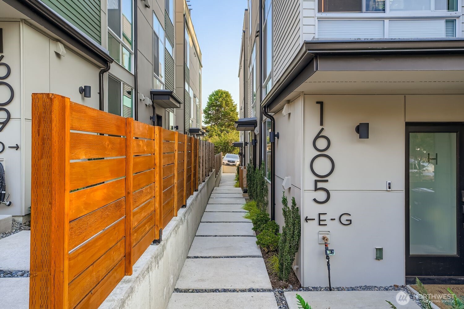 1605 South Washington Street, Unit F Seattle, WA 98144 - Photo 2 of 22 a view of a brick wall with windows