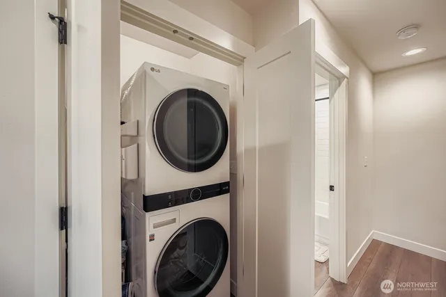 a view of a hallway with washer and dryer