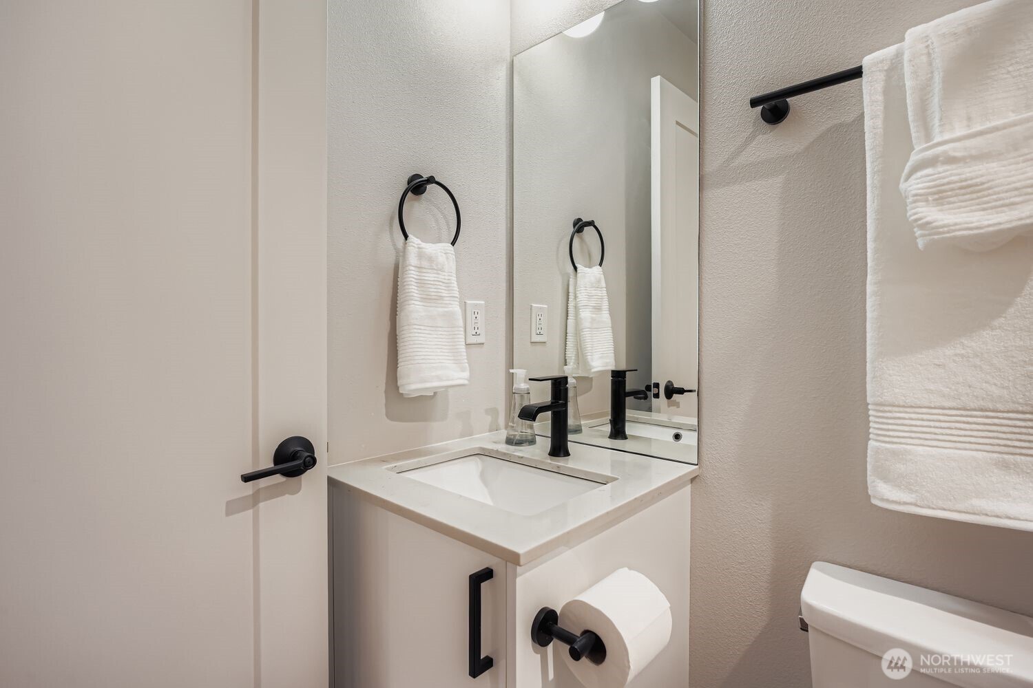 1605 South Washington Street, Unit F Seattle, WA 98144 - Photo 8 of 22 a bathroom with a sink and a mirror