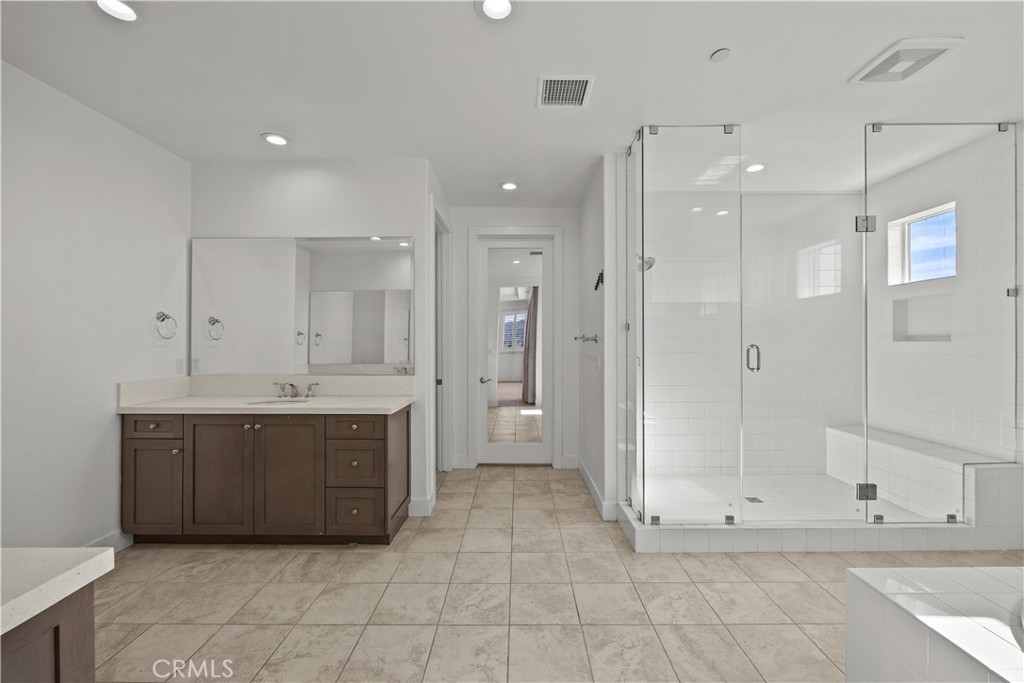 20638 Deer Grass Court Porter Ranch, CA 91326 - Photo 28 of 50 a bathroom with a sink a toilet and shower