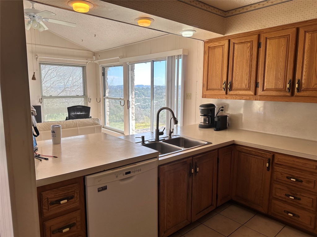 21418 Kathy Lane Spicewood, TX 78669 - Photo 11 of 40 a kitchen with a sink and cabinets