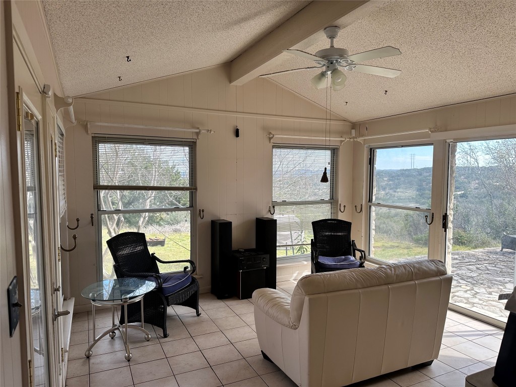 21418 Kathy Lane Spicewood, TX 78669 - Photo 14 of 40 a living room with furniture and a fireplace