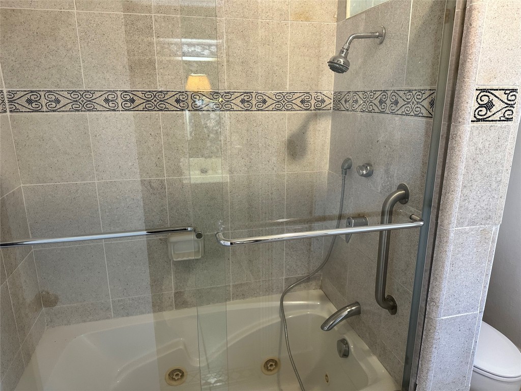 21418 Kathy Lane Spicewood, TX 78669 - Photo 16 of 40 a bathroom with a shower and a sink