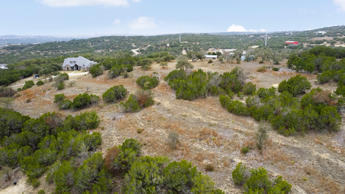 21418 Kathy Lane Spicewood, TX 78669 - Photo 29 of 40 an aerial view of residential houses with outdoor space and trees