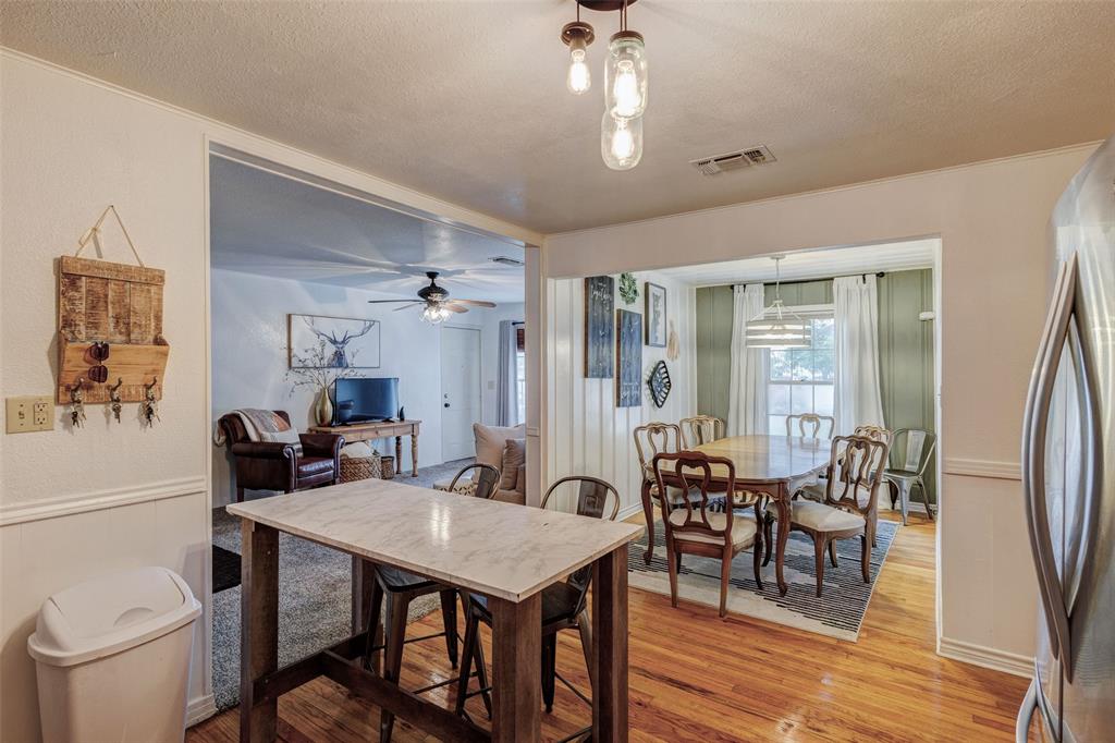 440 South Main Street Springtown, TX 76082 - Photo 14 of 33 a view of a dining room with furniture and wooden floor
