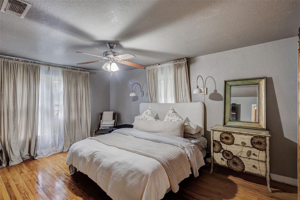 440 South Main Street Springtown, TX 76082 - Photo 18 of 33 a bedroom with bed and wooden floor