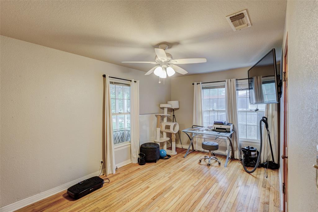 440 South Main Street Springtown, TX 76082 - Photo 19 of 33 a view of a workspace with wooden floor and furniture