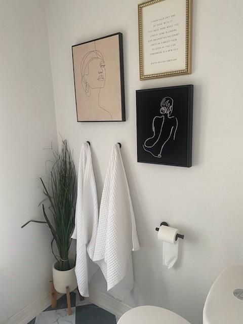 440 South Main Street Springtown, TX 76082 - Photo 27 of 33 a bathroom with a toilet and a sink