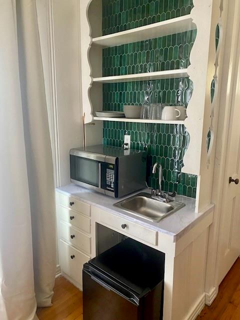440 South Main Street Springtown, TX 76082 - Photo 30 of 33 a kitchen with a stove and a microwave