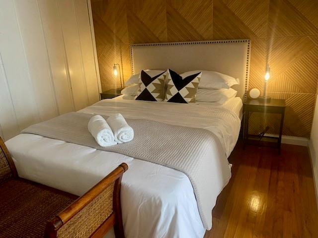 440 South Main Street Springtown, TX 76082 - Photo 32 of 33 a bedroom with a bed and wooden floor