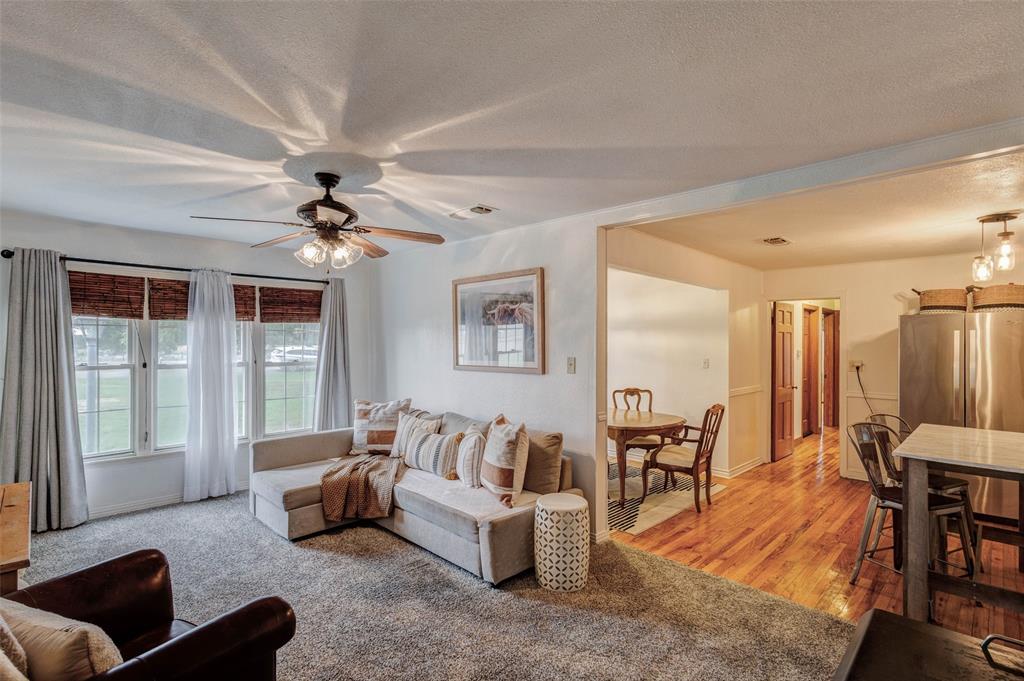 440 South Main Street Springtown, TX 76082 - Photo 8 of 33 a living room with furniture and a large window