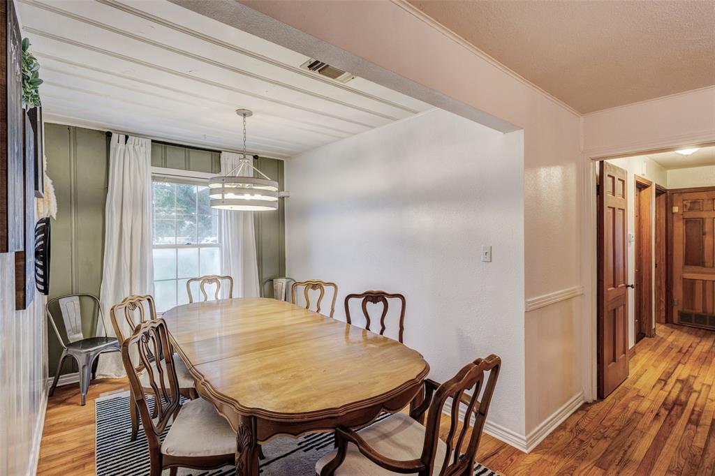 440 South Main Street Springtown, TX 76082 - Photo 10 of 33 a dining room with furniture and wooden floor