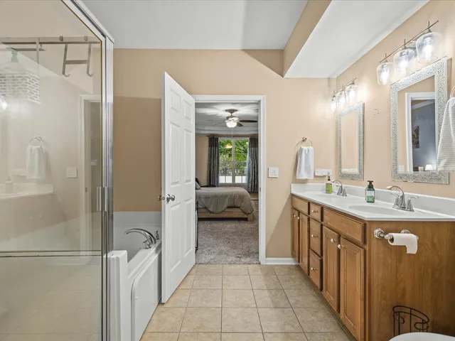 a bathroom with a double vanity sink and mirror