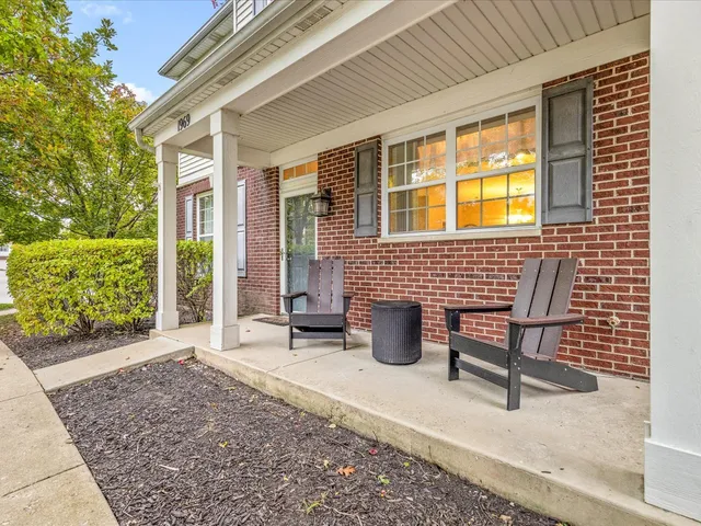 a view of swimming pool with sitting area