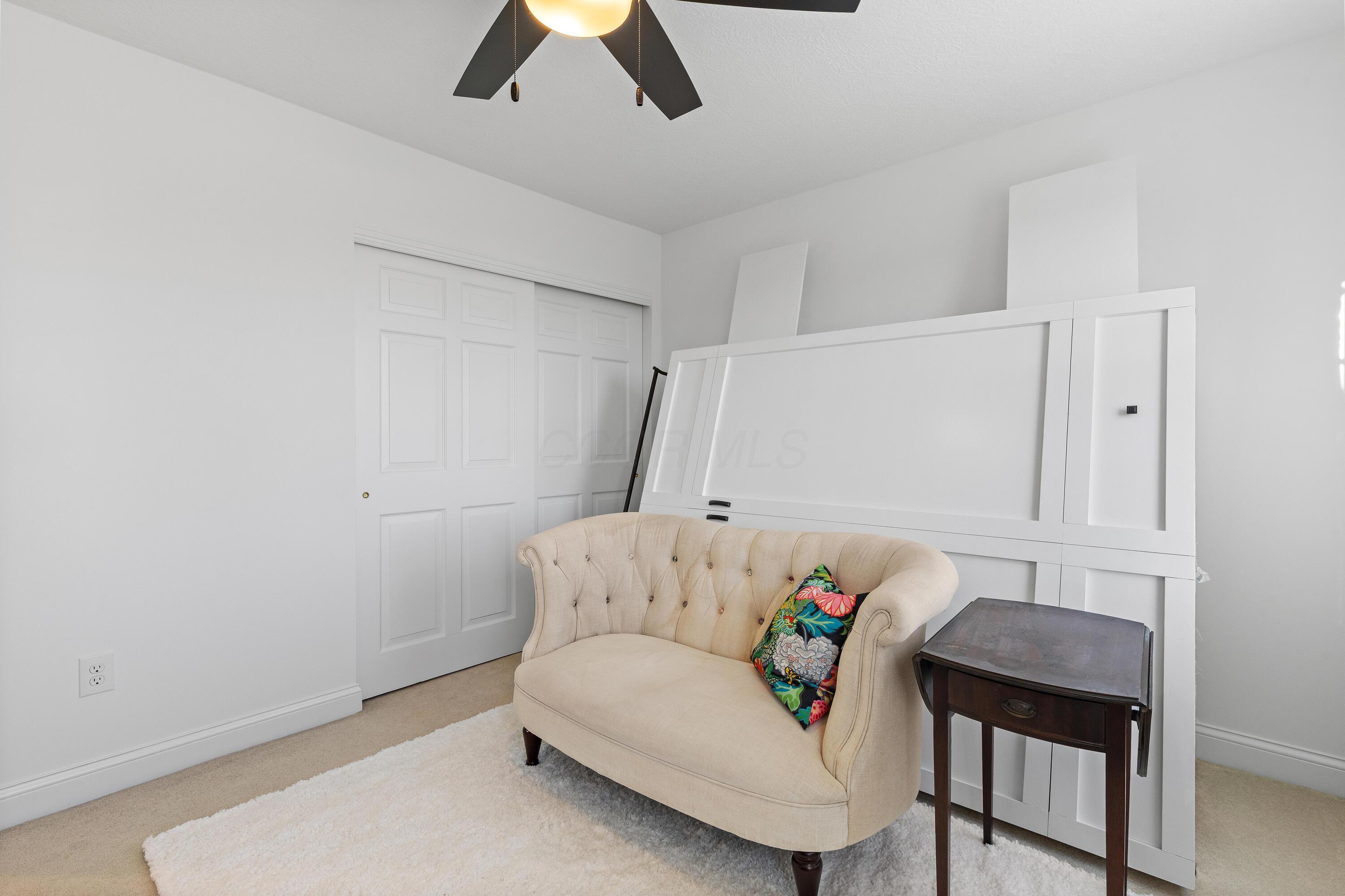 1364 Dale Ford Road Delaware, OH 43015 - Photo 68 of 112 • Light sand carpet • White painted walls • Lighted ceiling fan • Closet with double sliding doors • Drapes remain