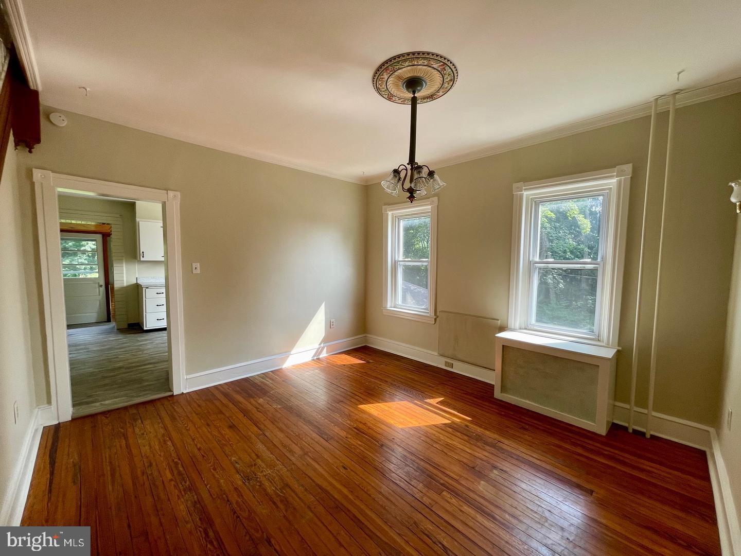 692 Lenni Road Aston, PA 19014 - Photo 7 of 28 a view of empty room with wooden floor and fan