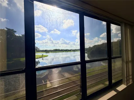 a view of a lake with a yard