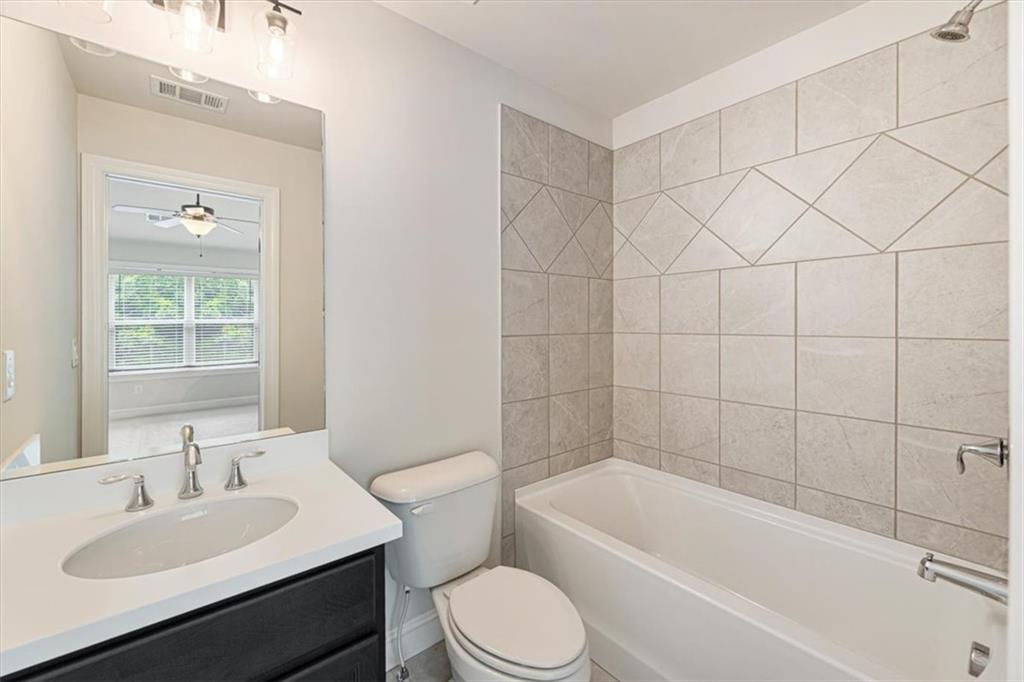 947 Hunter Way Milton, GA 30004 - Photo 72 of 78 a bathroom with a sink toilet vanity and bathtub