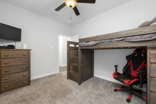 a living room with furniture and flat screen tv